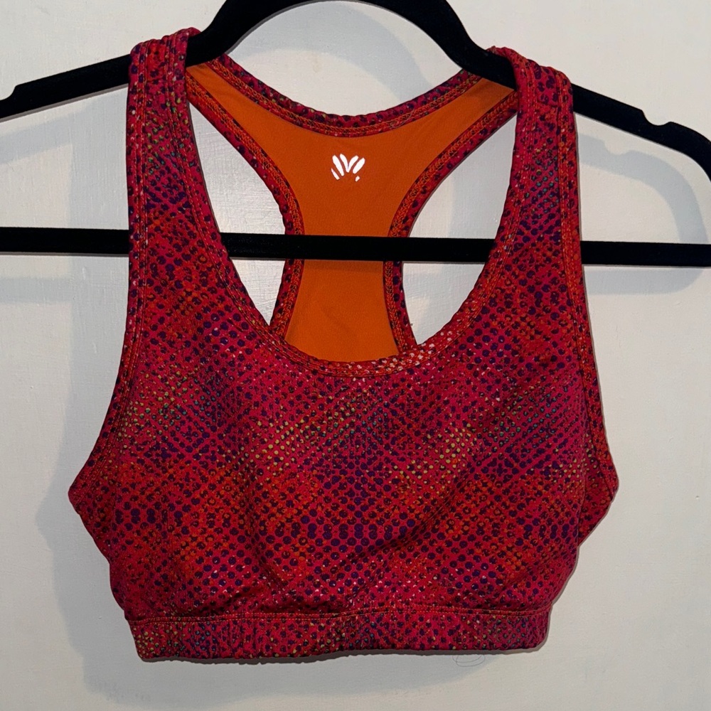 Pink, red, and orange patterned unlined sports bra